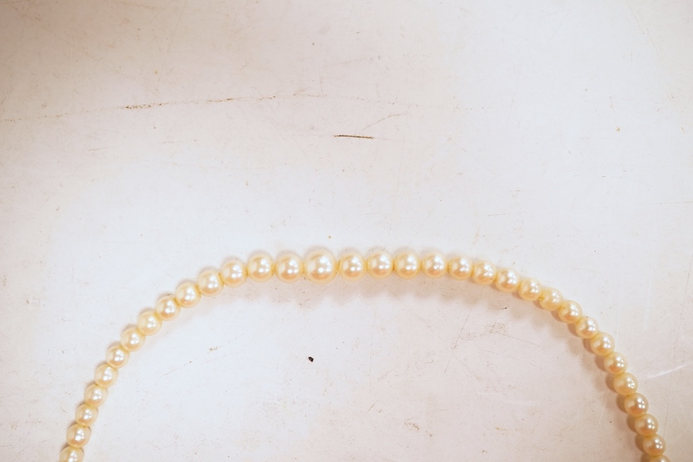 An eight-strand seed pearl choker necklace, with a rose-cut diamond clasp, length 34cm, pearls untested; together with a single strand graduated cultured pearl necklace, length 40cm, clasp stamped 9ct, Condition: good, s